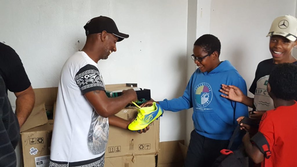 A soccer dreamer excited to receive his cleats